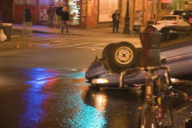 At the intersection of Smith &amp; Union streets in Brooklyn, "A drunk driver flipped his car. After the driver was taken away in handcuffs, the firefighters hosed down the street to get rid of the broken glass and spilled transmission fluid."